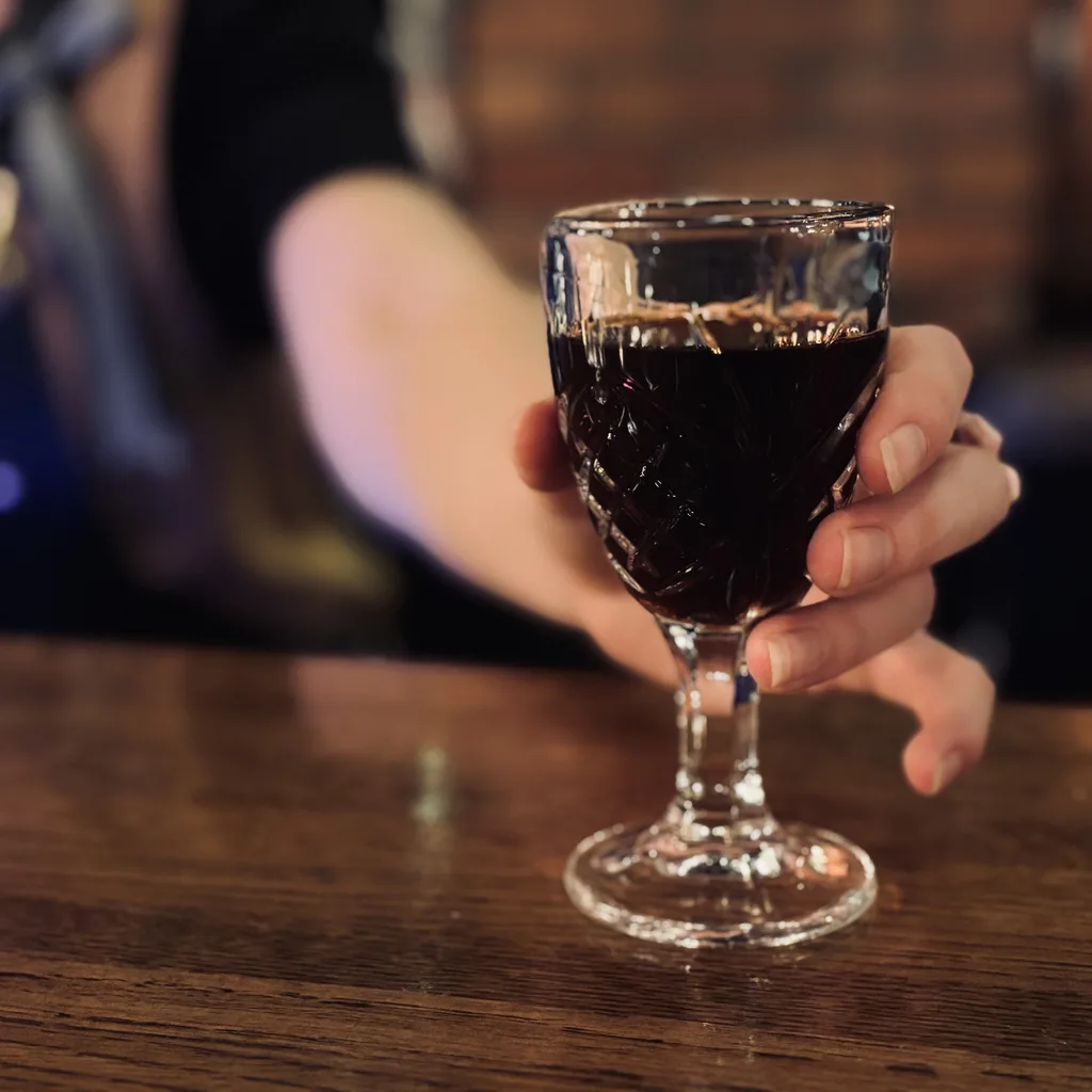 Cocktail flight presentation on a wooden board